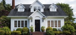 Image of a white house with black front door on PSA Insurance & Financial Services' website