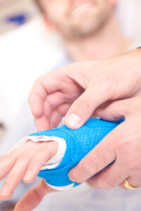 Image of a person holding an injured hand on PSA Insurance & Financial Services' website