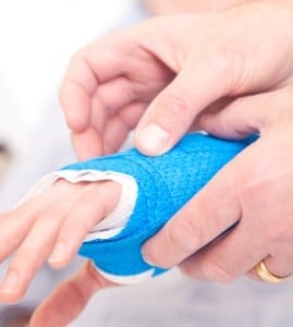 Imae of a person holding another person's hand which is in a cast on PSA Insurance & Financial Services' website