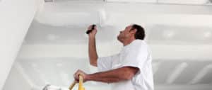 Image of a man painting a ceiling white on PSA Insurance & Financial Services' website