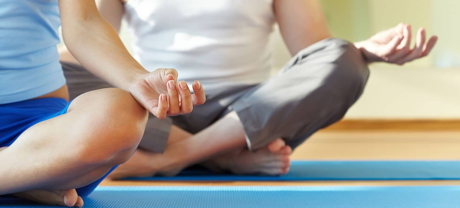 Image of a person with their legs crossed on a yoga mat on PSA Financial's website