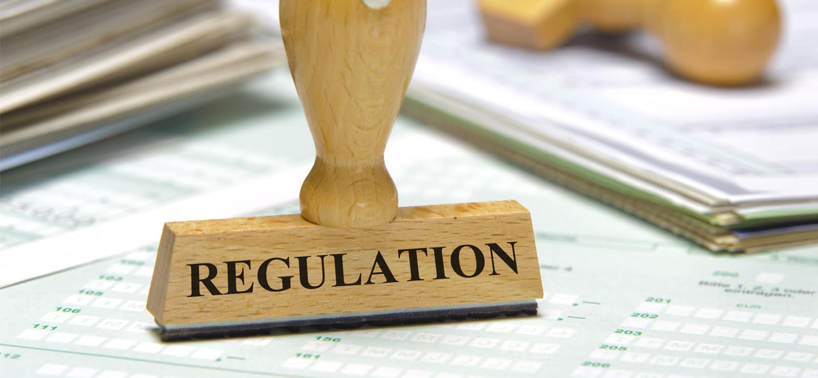 Image of the word Regulation on a piece of wood on PSA Financial's website