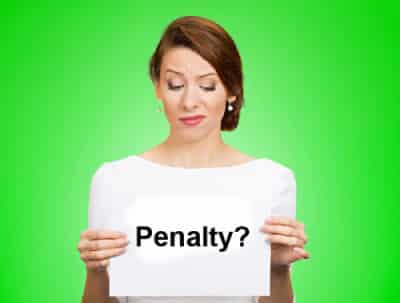 Image of a woman holding a piece of paper reading "penalty?" on PSA Insurance and Financial Services' website