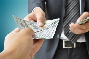 Image of a man holding cash on PSA Insurance and Financial Services' website