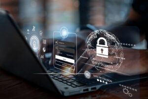 Graphic image of cybersecurity icons over a person's hands typing on a laptop on PSA's website