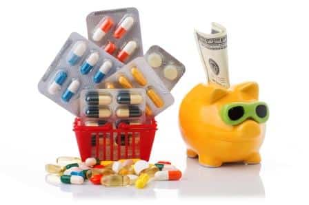 Image of a piggy bank with cash, a mini shopping basket, and various pills