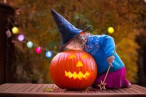 Image of a child with a jack-o-lantern