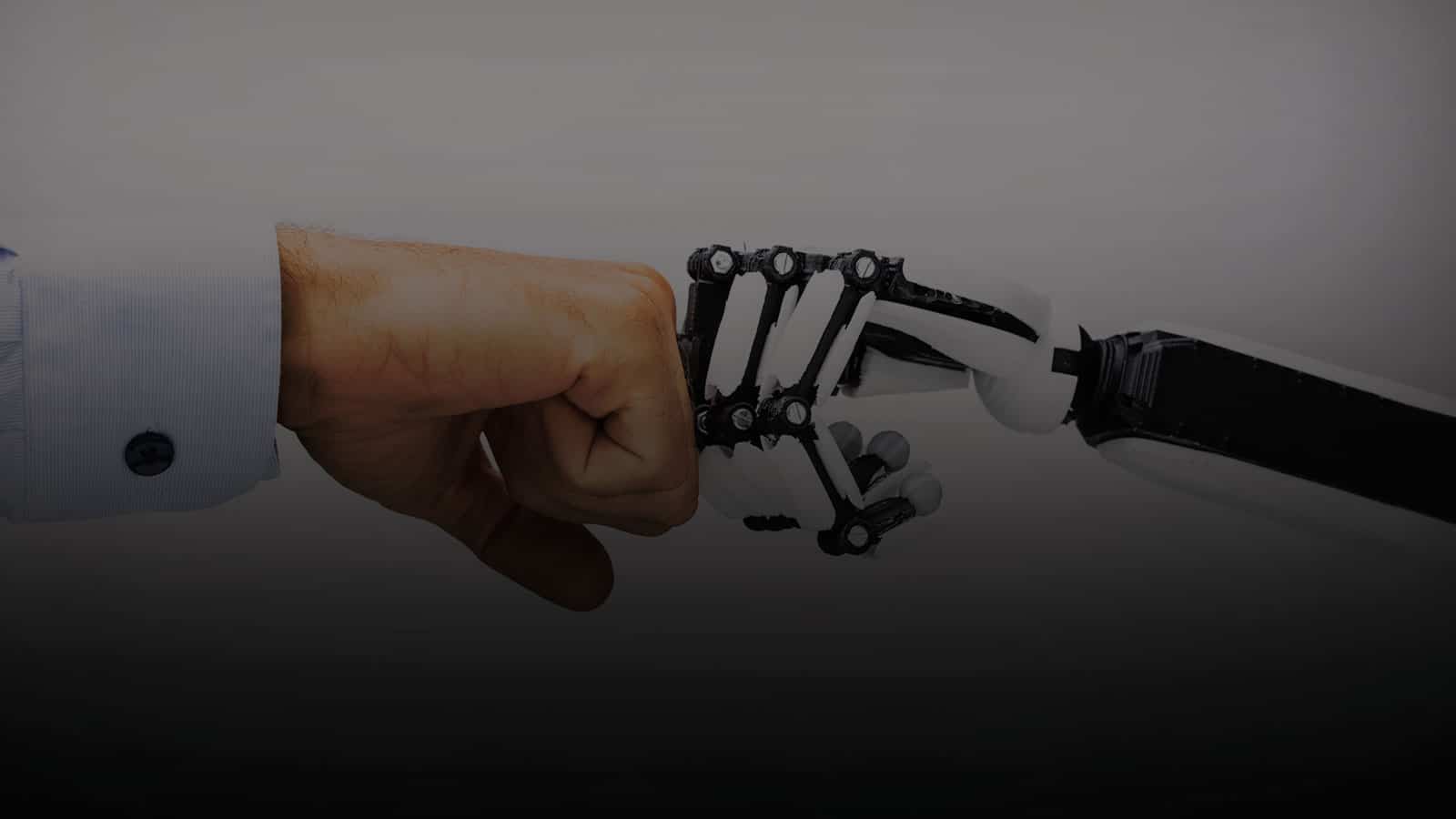 Man and Robot fist bumping