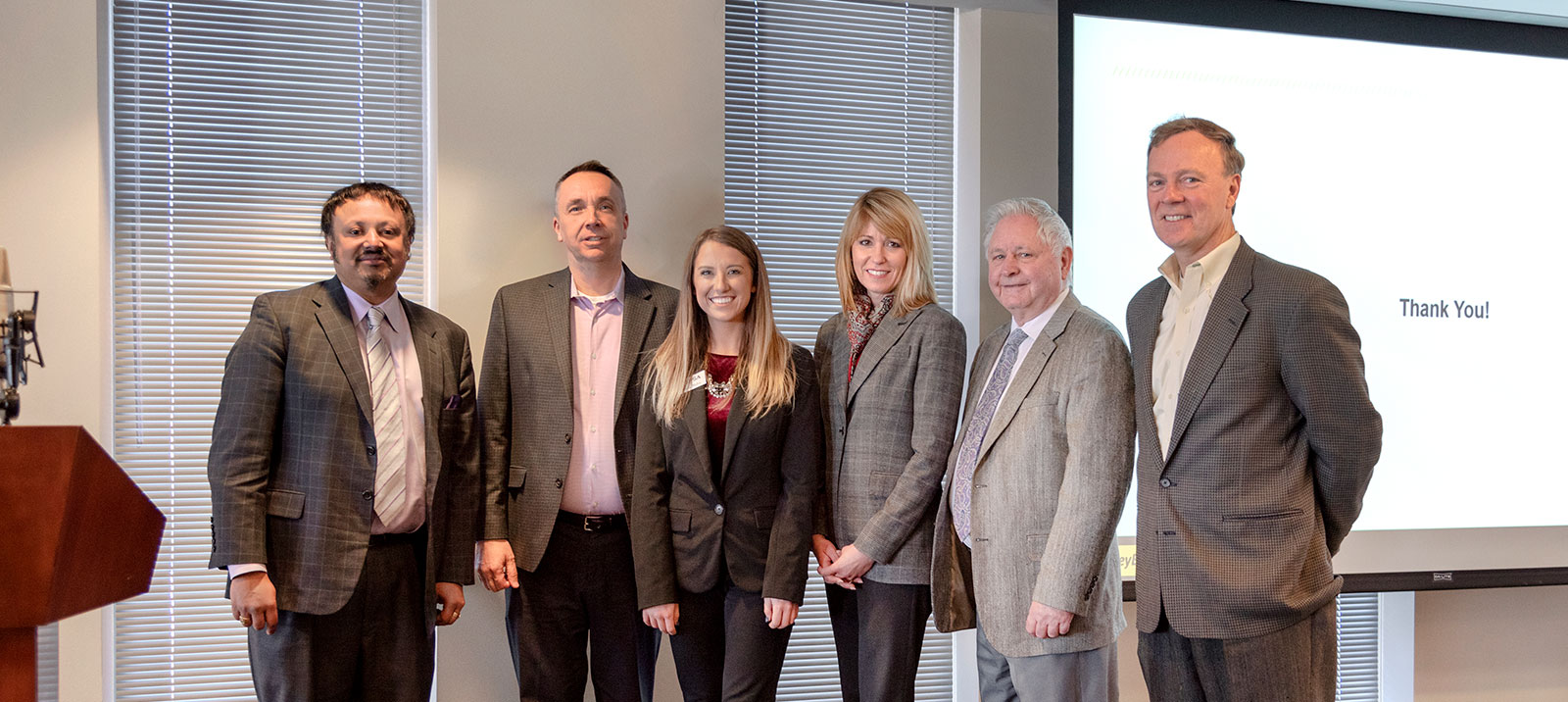 Image of smiling men and women on PSA Insurance & Financial Services' website