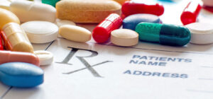 Image of pills and capsules on a prescription slip on PSA Insurance & Financial Services' website