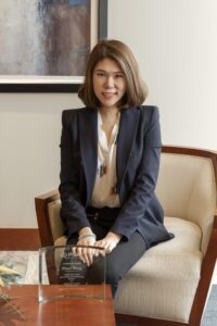 Businesswoman taking a picture in an office on PSA Insurance & Financial Services' website