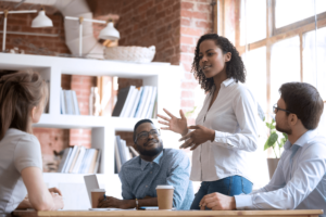 A person speaking to a seated group on PSA Financial's website