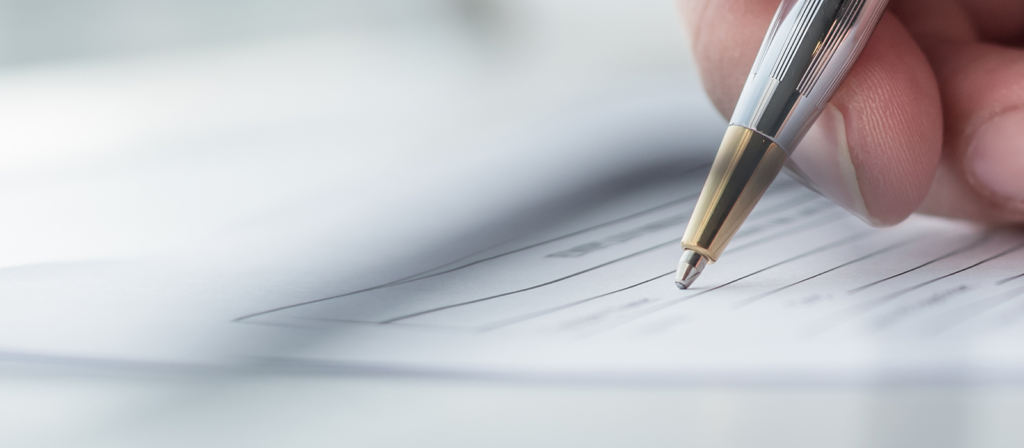 A person writing on paper on PSA Financial's website