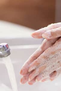 A person washing their hands on PSA Financial's website