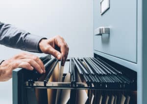 Image of person looking through file cabinet on PSA Financial's website