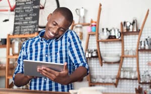 Image of a man holding an ipad on PSA Financial's website