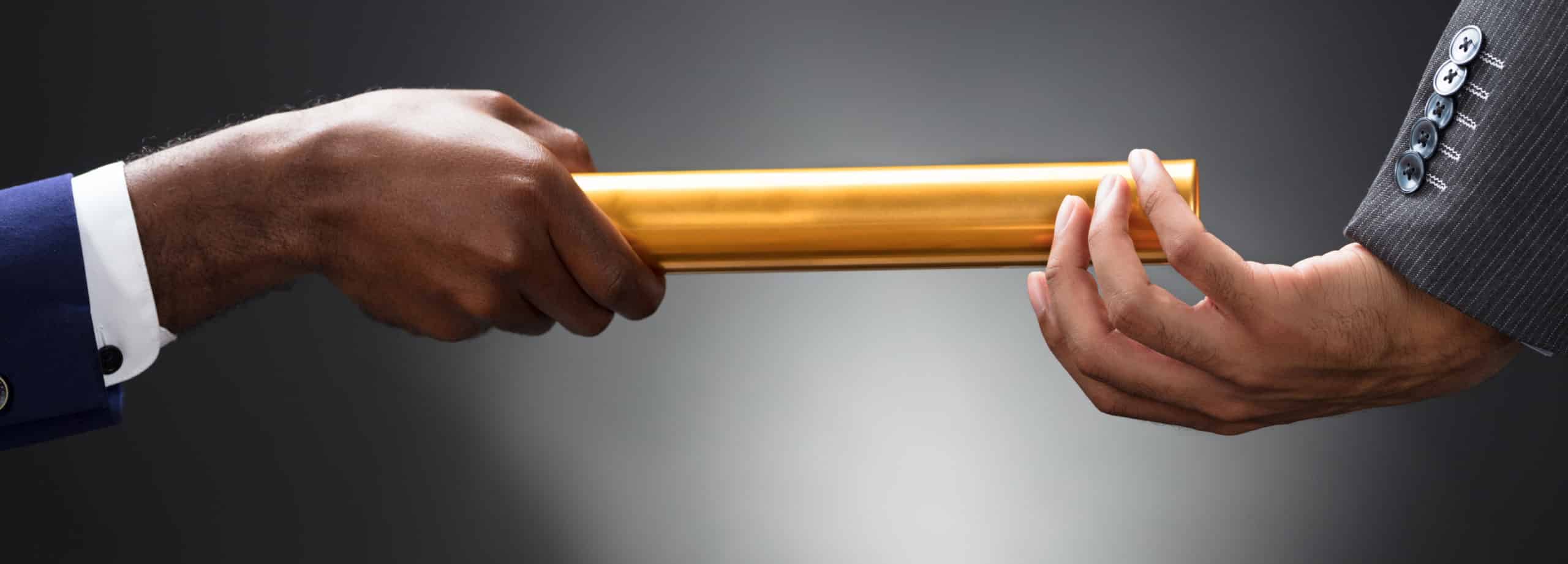 Image of one person passing a baton to another on PSA Financial's website