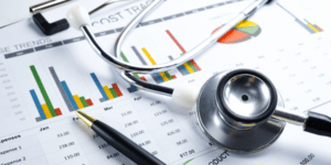 Image of a stethescope and pen on a chart on PSA Insurance & Financial Services' website