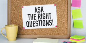 image of sign with Ask the Right Questions on bulletin board