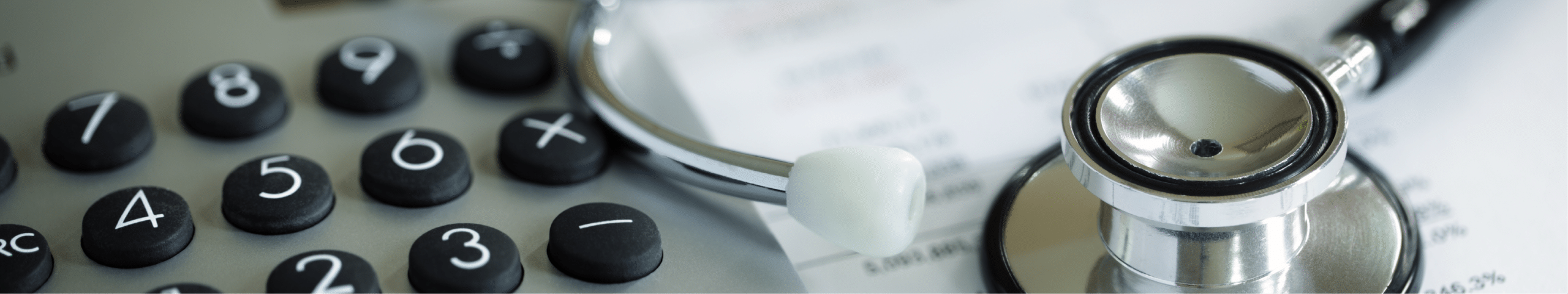 Image of a calculator and stethescope