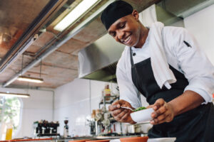 Image of a chef plating food