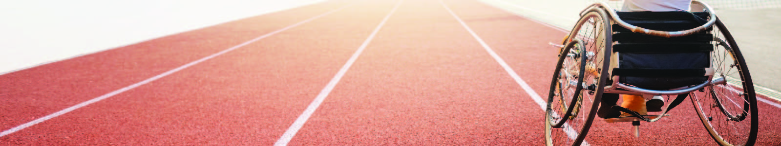 Image of a person in a wheelchair on a track
