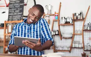 person looking at his tablet