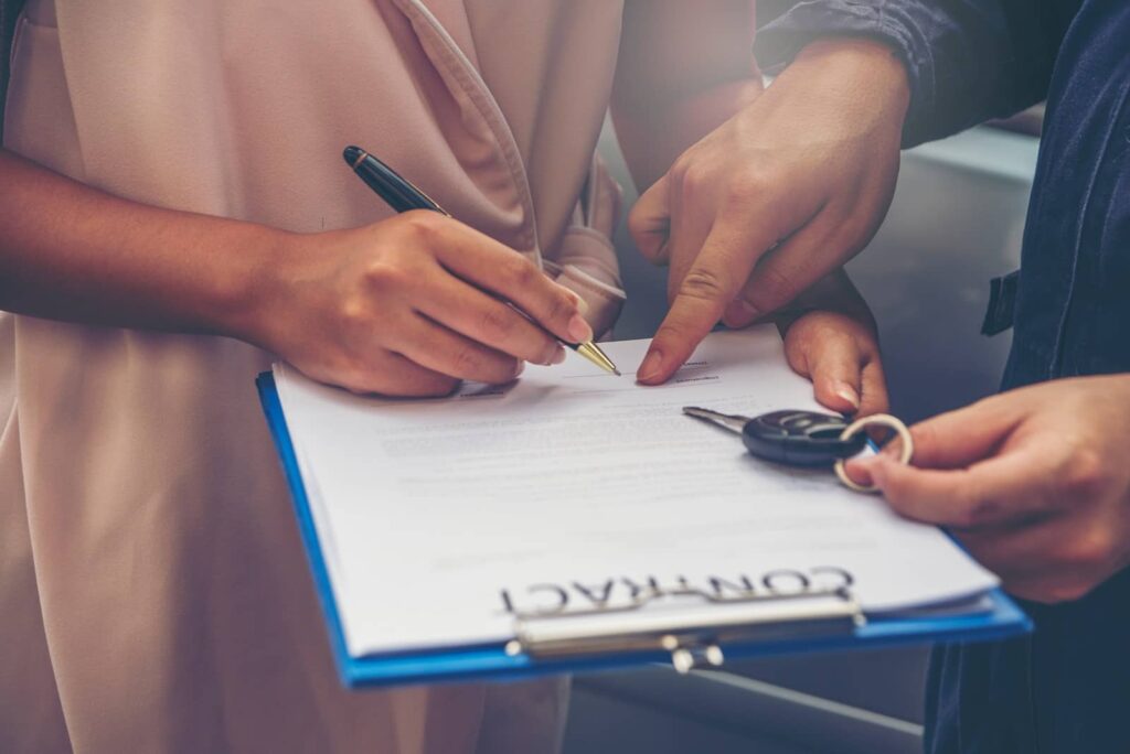 people signing a contract