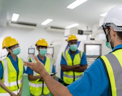 Image of workers consulting at a worksite