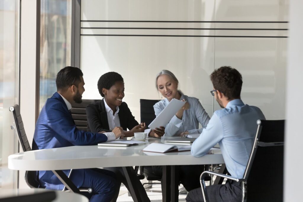 Image of employees at a desk