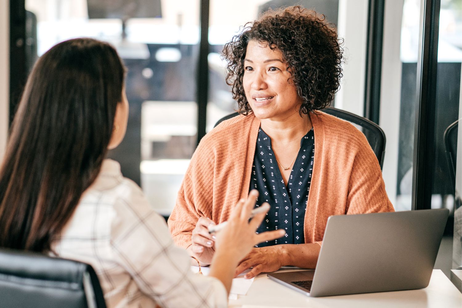 Image of two women consulting at a desk