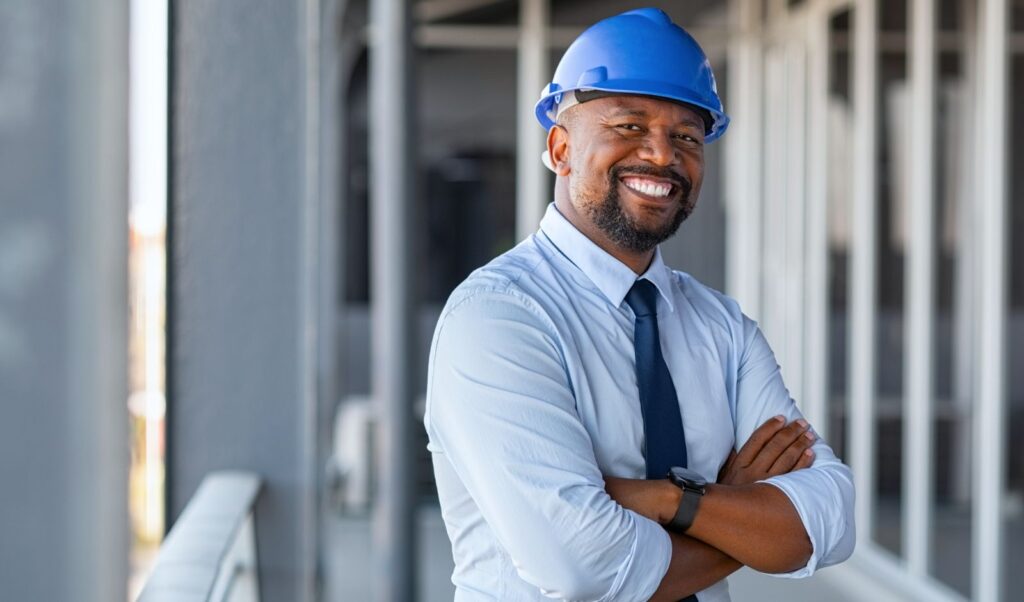 Image of a smiling man in a hardhat
