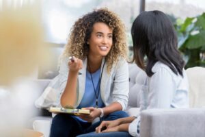 Image of two women consulting