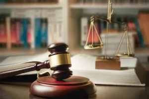 Image of a gavel and the scales of justice on a desk
