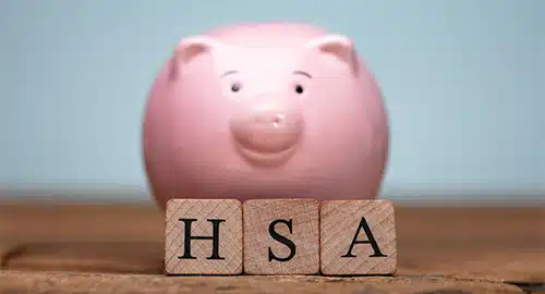 Image of a piggy bank and letter blocks reading "HSA"