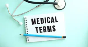Image of a notepad reading "Medical Terms" with a pencil and stethoscope